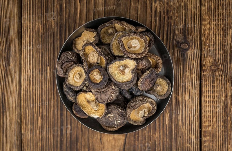 Dried Shiitake on a vintage background as detailed close-up shot, selective focus