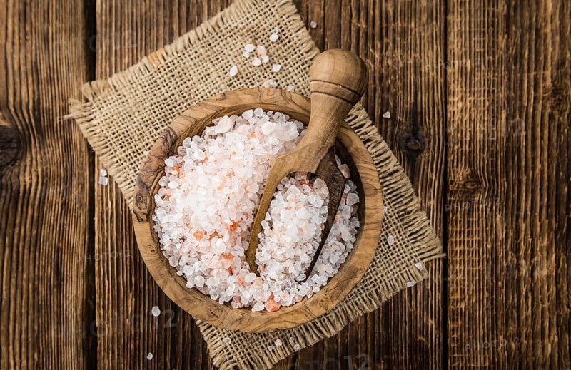 Pink Salt on a vintage background as detailed close-up shot (selective focus)