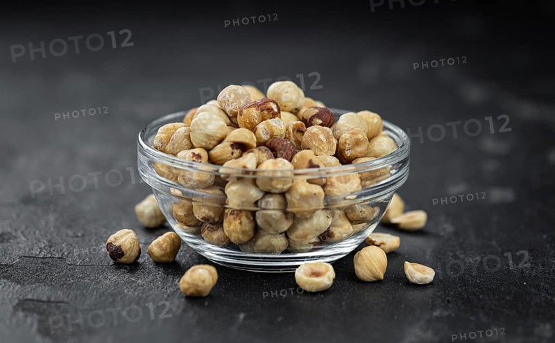 Peeled Hazelnuts as detailed close up shot (selective focus)