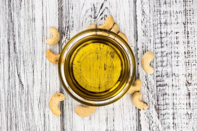 Portion of Cashew Oil (detailed close up shot, selective focus)
