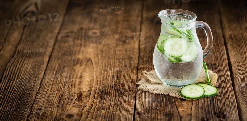 Cucumber Water on a vintage background as detailed close-up shot, selective focus