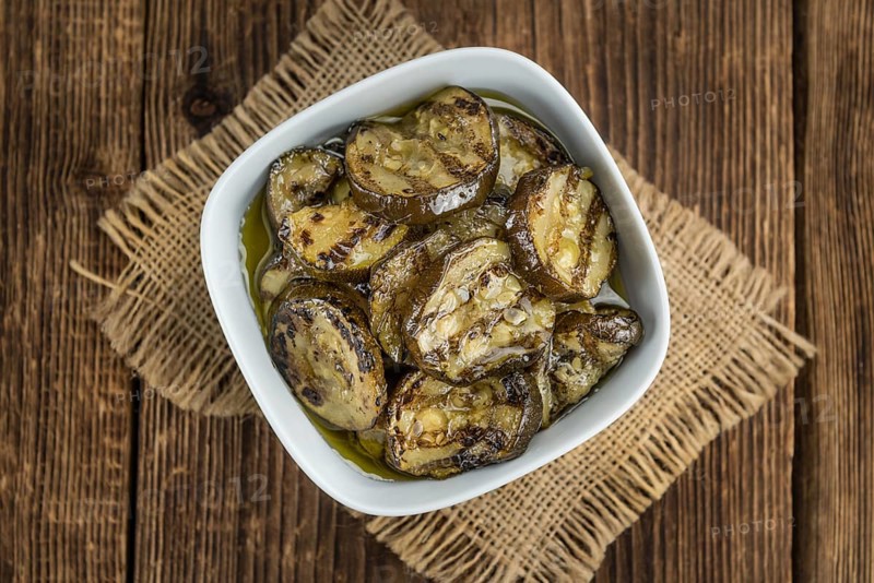 Homemade Antipasti (Grilled Zucchinis) on vintage background (selective focus, close-up shot)
