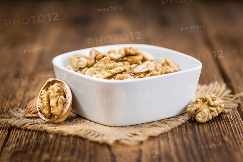 Portion of fresh Walnut kernels (close-up shot, selective focus)