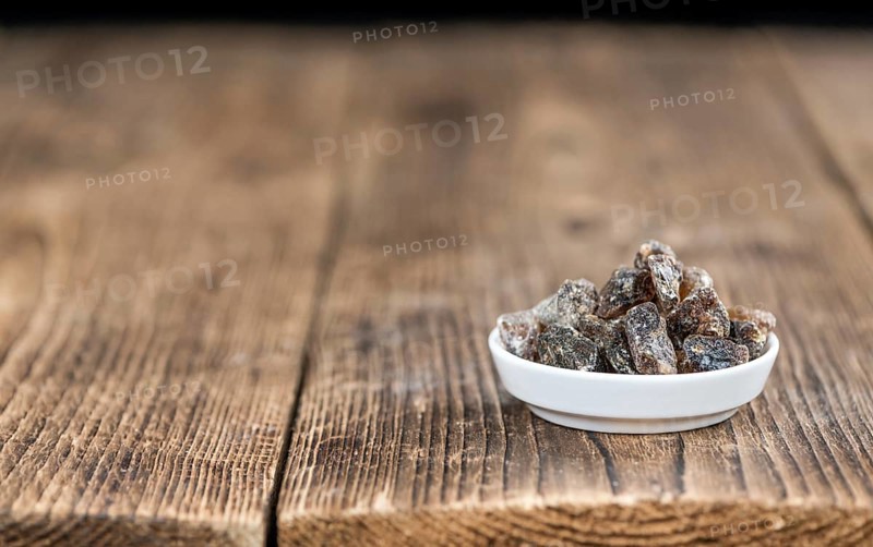 Portion of brown Rock Candy as detailed close-up shot (selective focus)