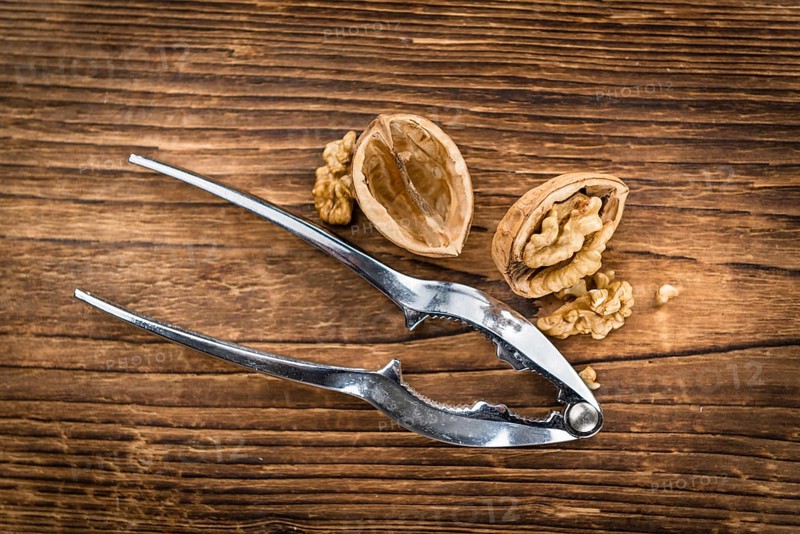 Walnuts on a vintage background as detailed close-up shot (selective focus)