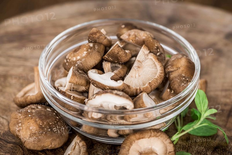 Portion of fresh Shiitake mushrooms close-up shot, selective focus