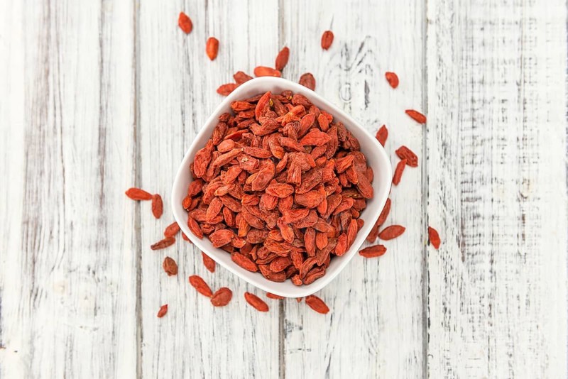Goji Berries on a vintage background as detailed close-up shot (selective focus)