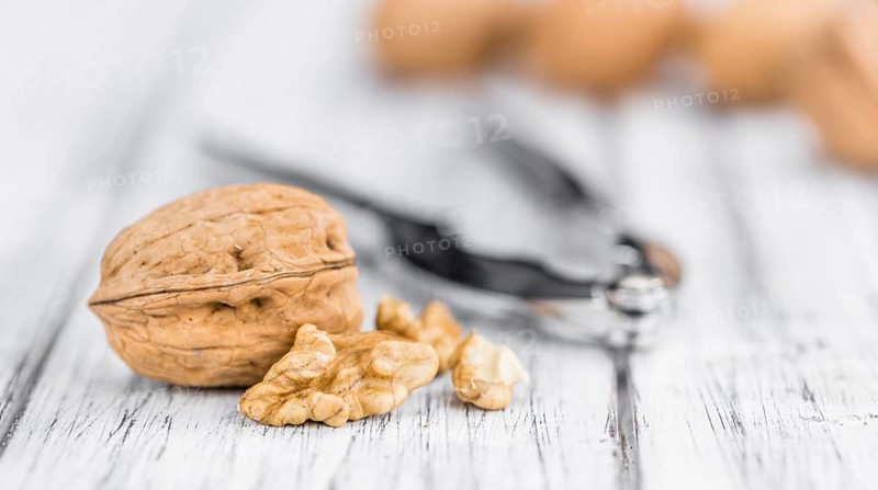 Walnuts on a vintage background as detailed close-up shot (selective focus)
