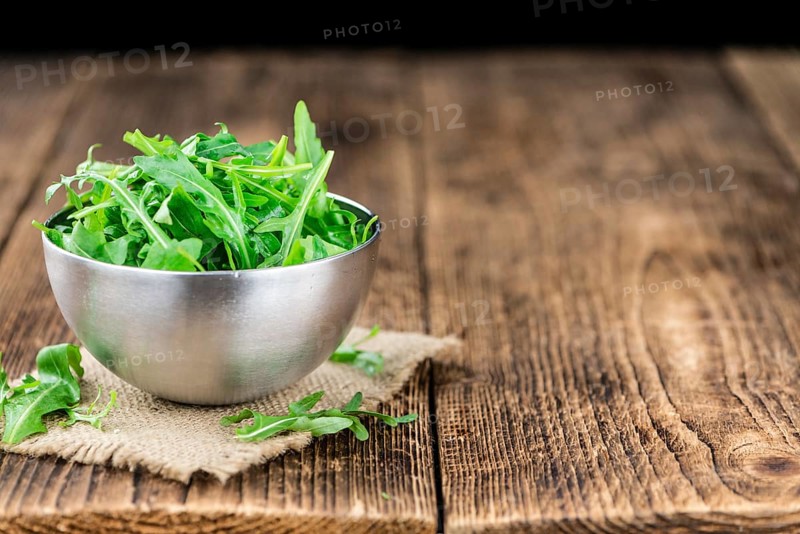Portion of fresh Arugula (detailed close-up shot, selective focus)