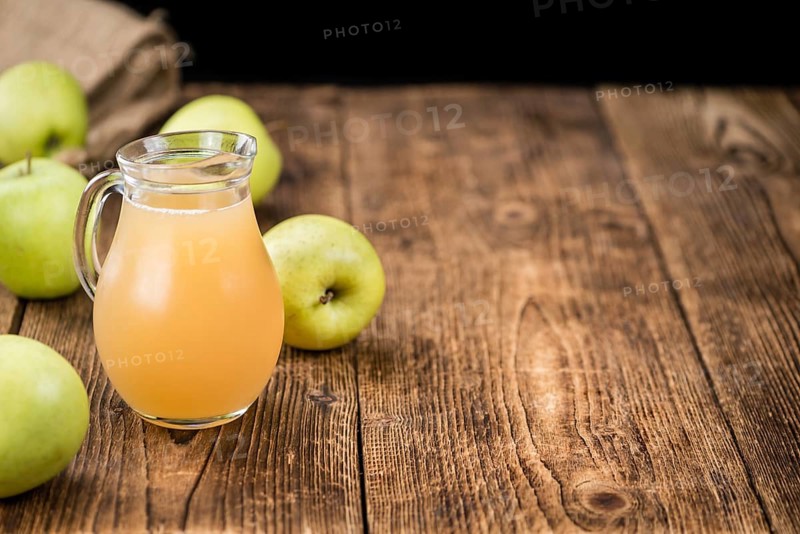 Fresh made Juice (apple) on a vintage background (close-up shot)