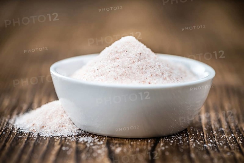 Pink Salt on a vintage background as detailed close-up shot (selective focus)