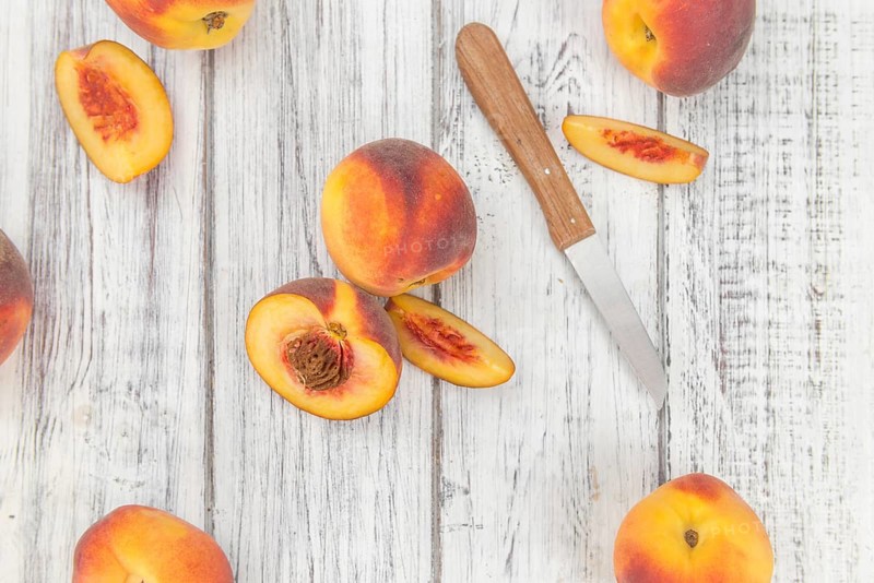 Portion of fresh Peaches close-up shot, selective focus