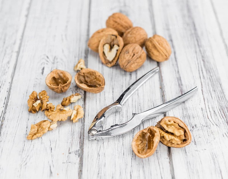 Walnuts on a vintage background as detailed close-up shot (selective focus)