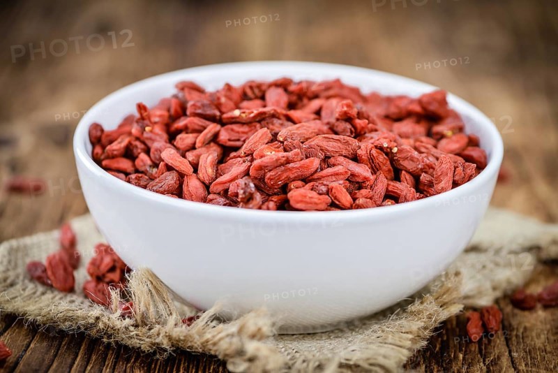 Goji Berries on a vintage background as detailed close-up shot (selective focus)