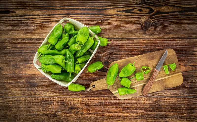 Raw Pimientos on a vintage background as detailed close-up shot, selective focus