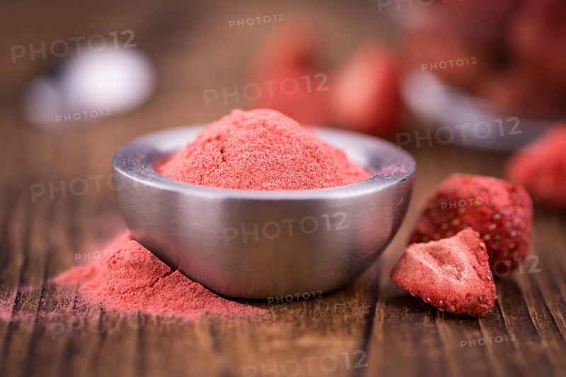 Fresh made Strawberry powder on a vintage background as detailed close-up shot