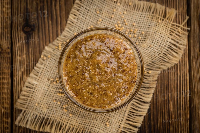 Sweet Mustard on a vintage background as detailed close-up shot (selective focus)