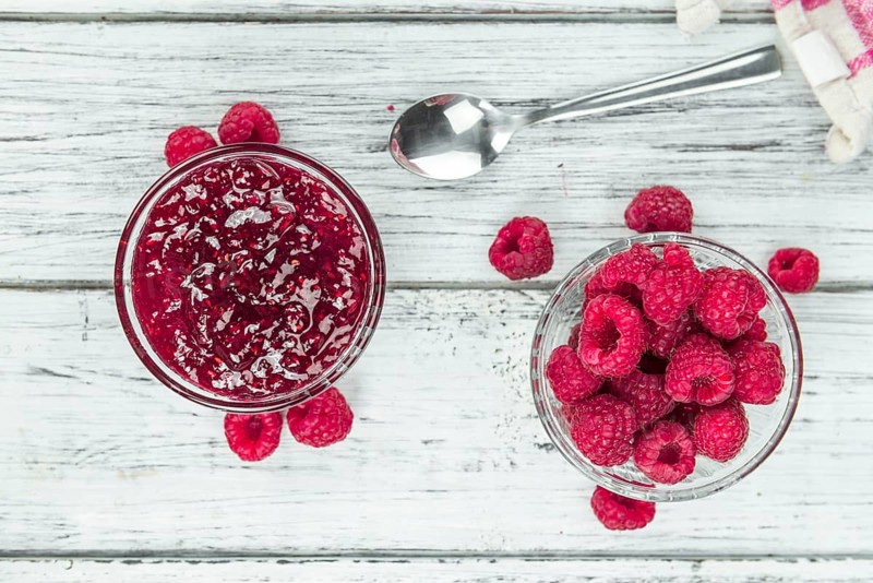 Some homemade Raspberry Jam as detailed close-up shot, selective focus