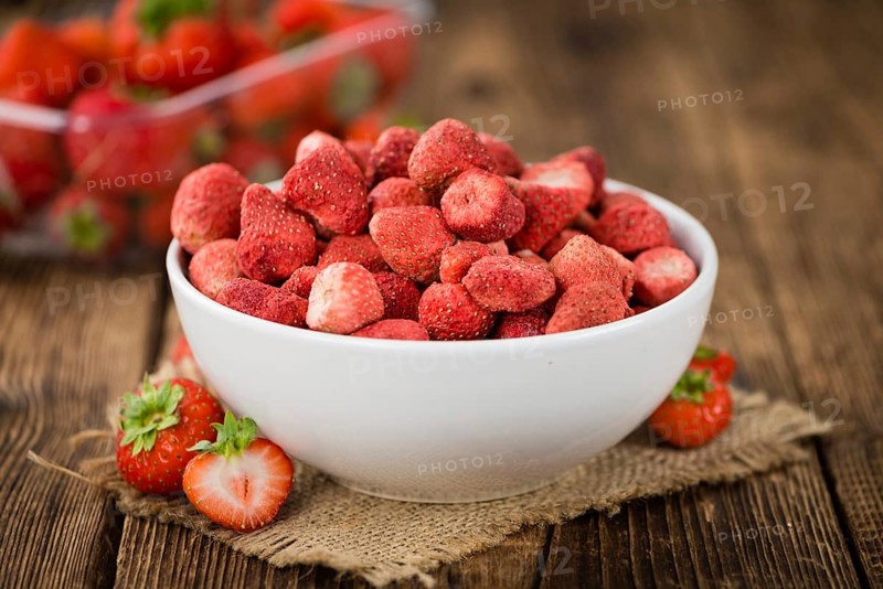 Dried Strawberries on a vintage background as detailed close-up shot, selective focus