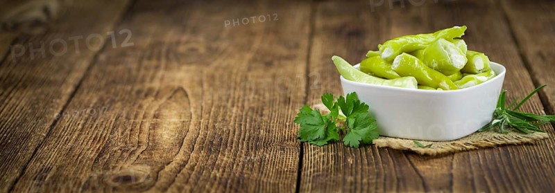 Some homemade Green Chilis (filled with cheese) (selective focus) as detailed close-up shot