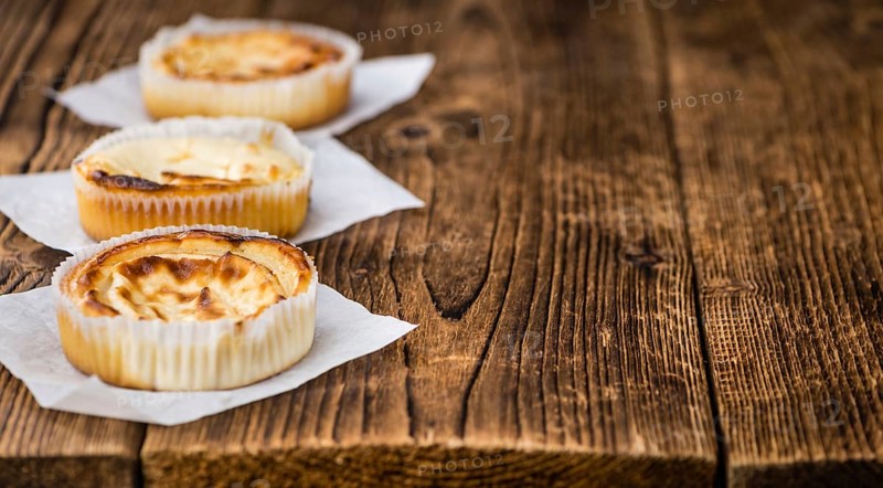 Homemade Cheesecake on an wooden table (selective focus) as detailed close-up shot