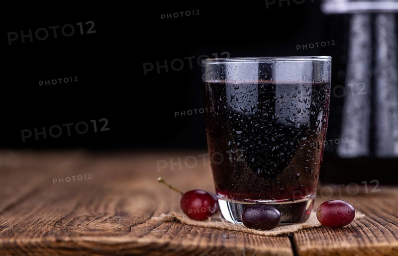 Some fresh Red Grape Juice (selective focus, close-up shot)