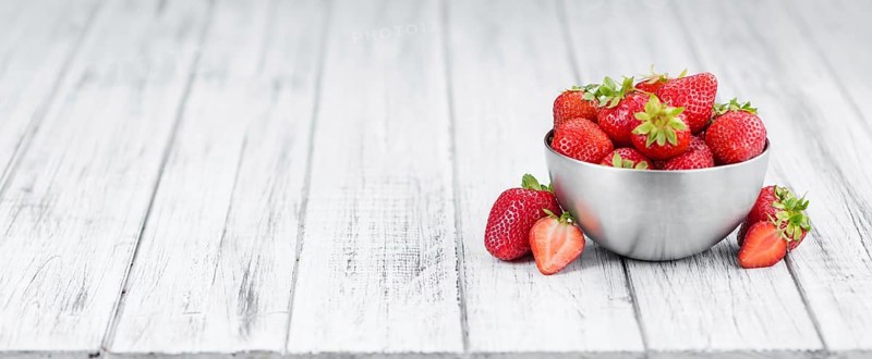 Portion of fresh Strawberries close-up shot, selective focus
