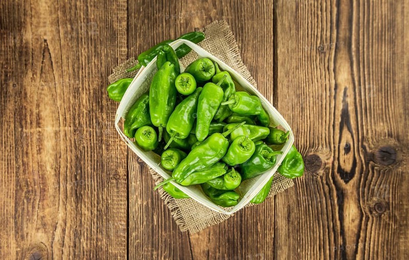Raw Pimientos on a vintage background as detailed close-up shot, selective focus