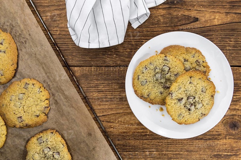 Chocolate Chip Cookies on an old wooden table (selective focus)