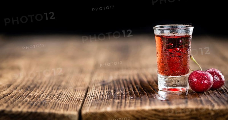 Some homemade Cherry Liqueur as detailed close-up shot, selective focus