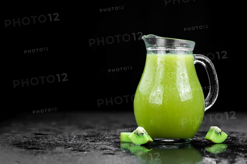 Fresh made Kiwi Smoothie (selective focus) on a vintage looking background