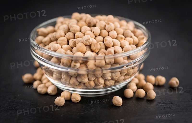 Chickpeas on a vintage background as detailed close-up shot, selective focus