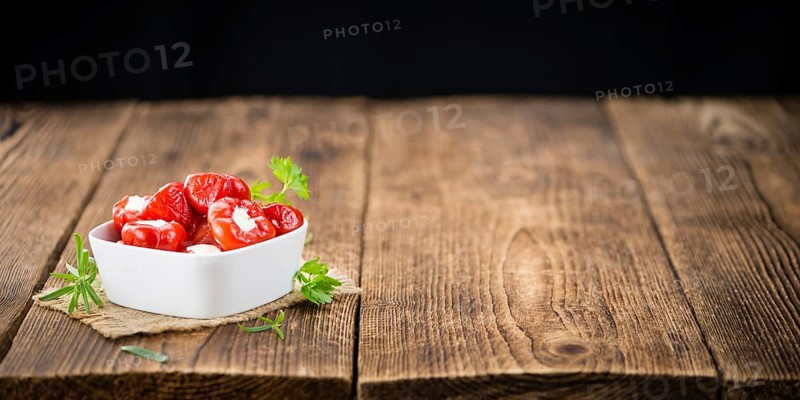 Some homemade Red Pepper (stuffed with cheese) (selective focus) as detailed close-up shot