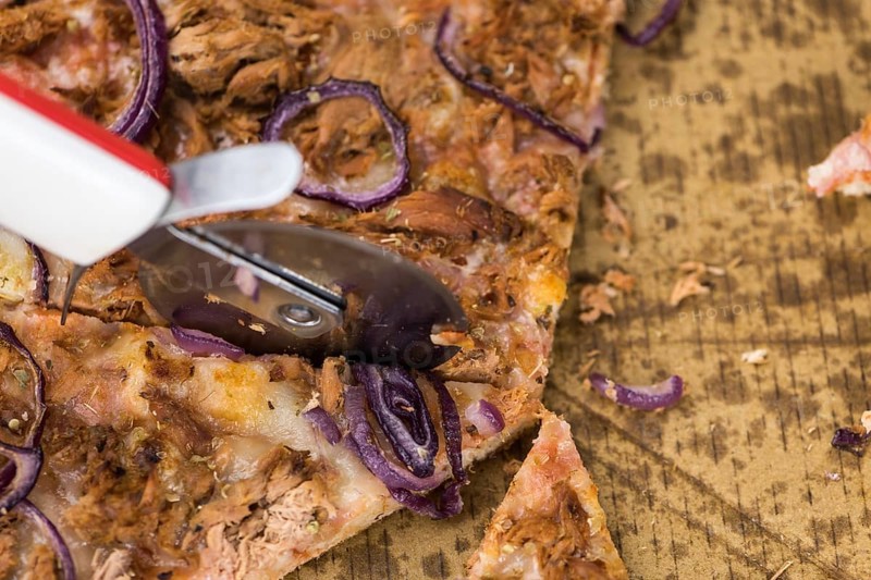 Portion of sliced Pizza (detailed close-up shot, selective focus)