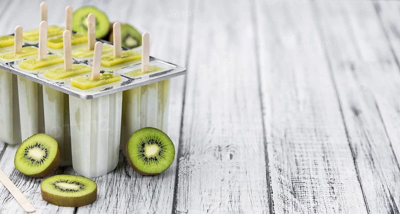 Kiwi Popsicles (fresh) as detailed close-up shot, selective focus)