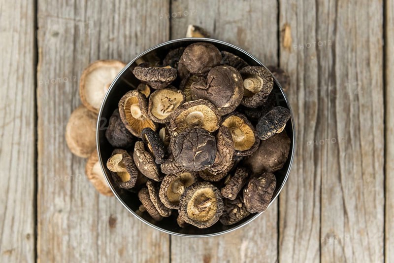 Dried Shiitake on a vintage background as detailed close-up shot, selective focus