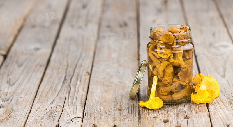 Portion of fresh Canned chanterelles close-up shot, selective focus