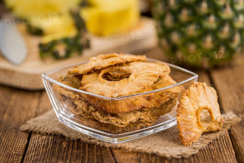 Some homemade Dried Pineapple Rings as detailed close-up shot, selective focus