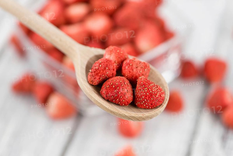 Dried Strawberries on a vintage background as detailed close-up shot, selective focus
