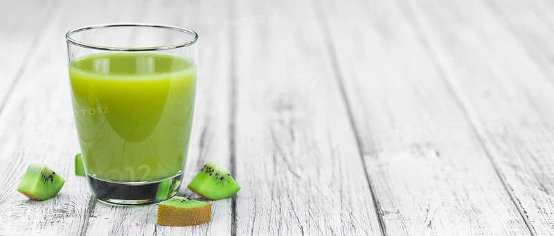 Fresh made Kiwi Smoothie (selective focus) on a vintage looking background