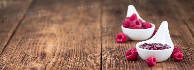 Fresh made Raspberry Jam on a vintage background as detailed close-up shot