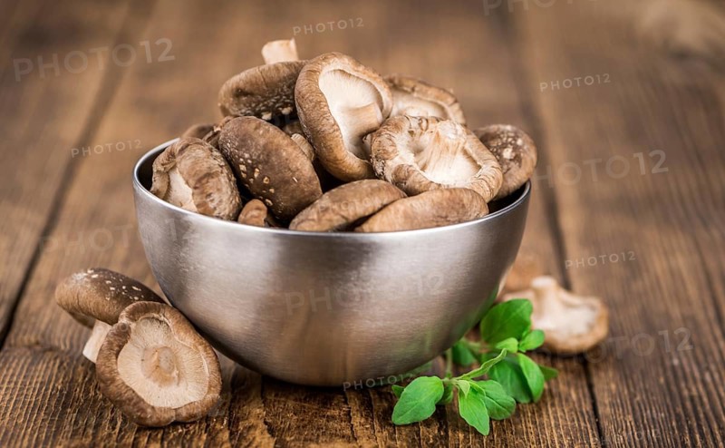 Portion of fresh Shiitake mushrooms close-up shot, selective focus