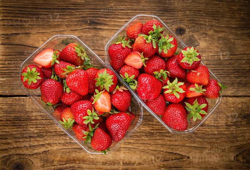Strawberries on a vintage background as detailed close-up shot, selective focus