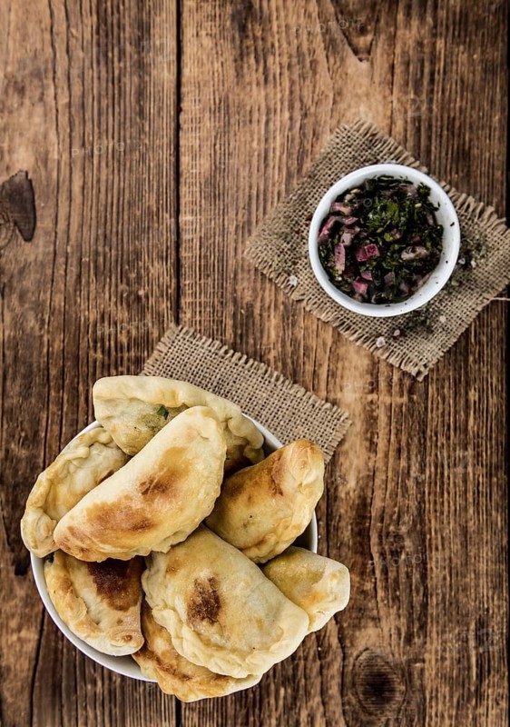 Portion of fresh homemade Empanadas as detailed close-up shot, selective focus