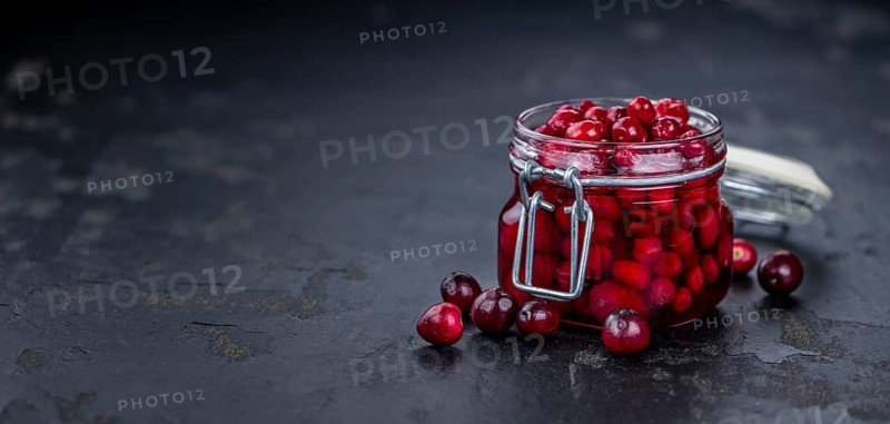 Portion of Preserved Cranberries as detailed close-up shot, selective focus