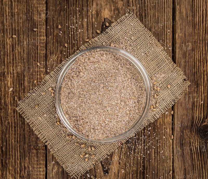 Portion of Wheat Bran as detailed close-up shot, selective focus