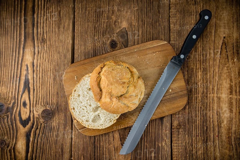 Fresh made German Buns on an old and rustic wooden table, selective focus, close-up shot