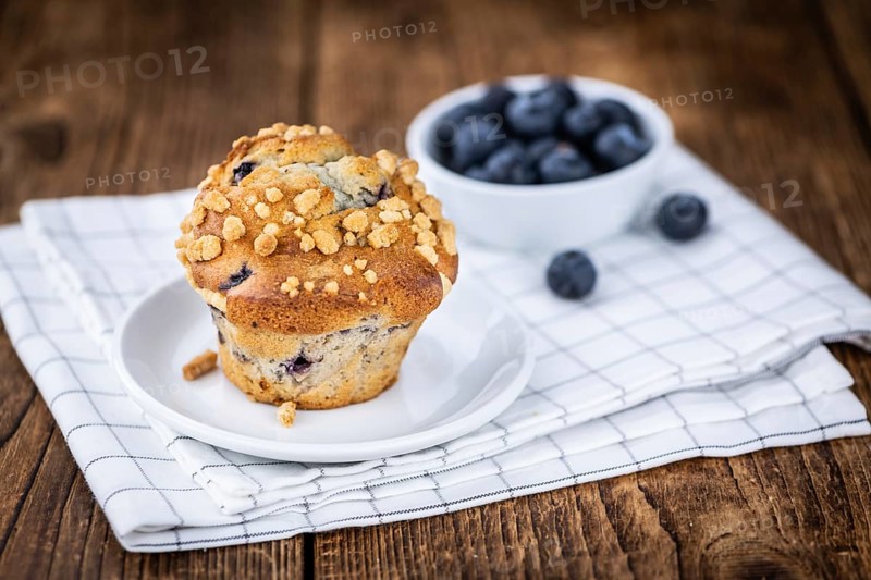 Fresh Blueberry Muffins as detailed close-up shot (selective focus)