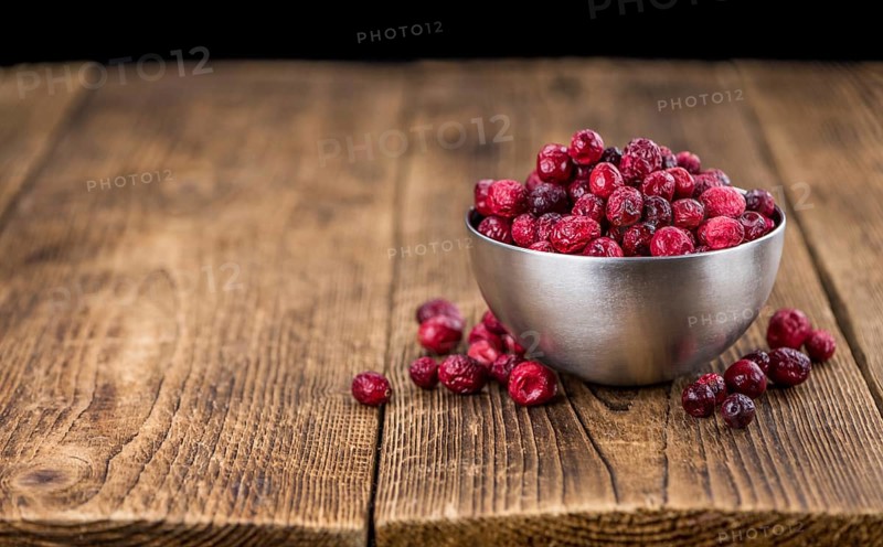 Portion of Dried Cranberries as detailed close-up shot, selective focus