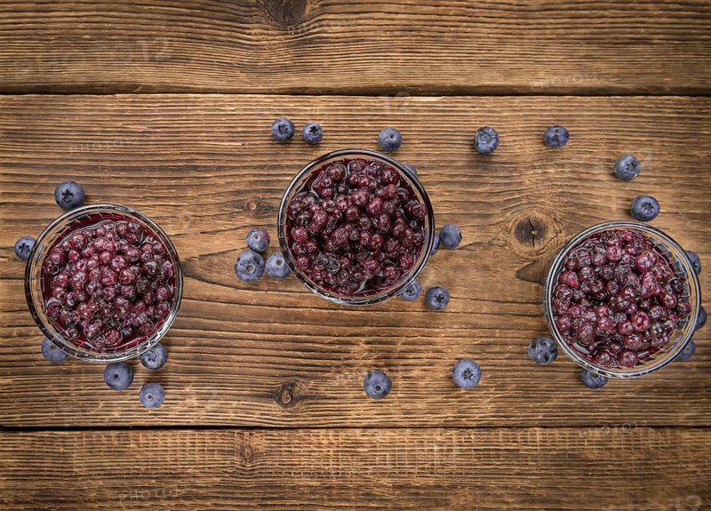 Fresh made Blueberries (preserved) on an old and rustic wooden table, selective focus, close-up shot